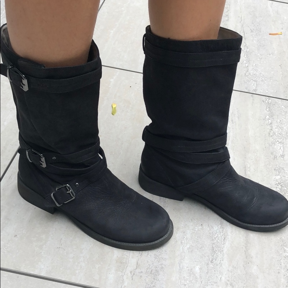 Black leather boots with buckles